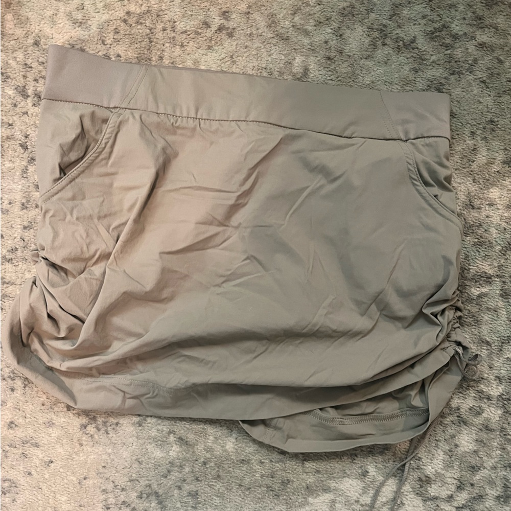 tan golf skort with pockets and ruched sides